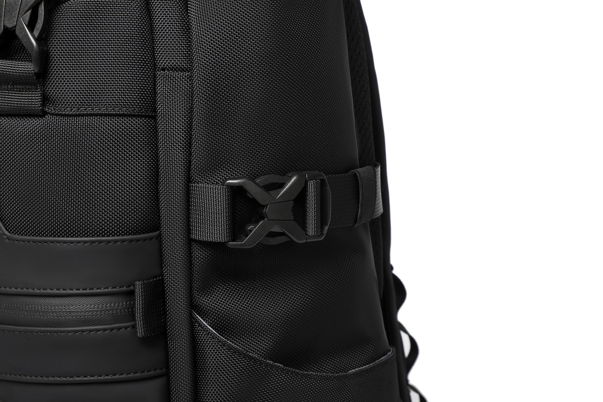 Summit Backpack 25L in Black, close-up of the side compression strap buckle