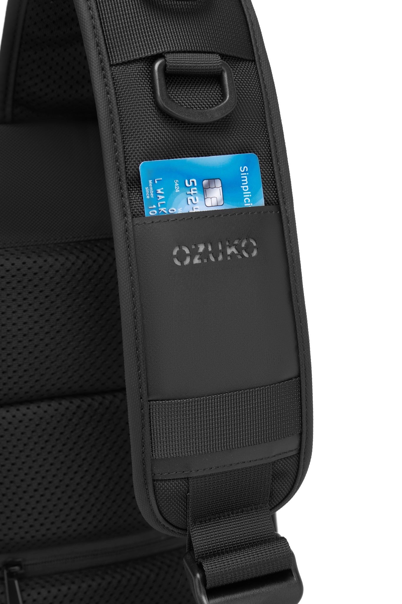 Daytrip Backpack 12L in Black - close-up of the strap with a pair of sunglasses hooked onto the D-ring