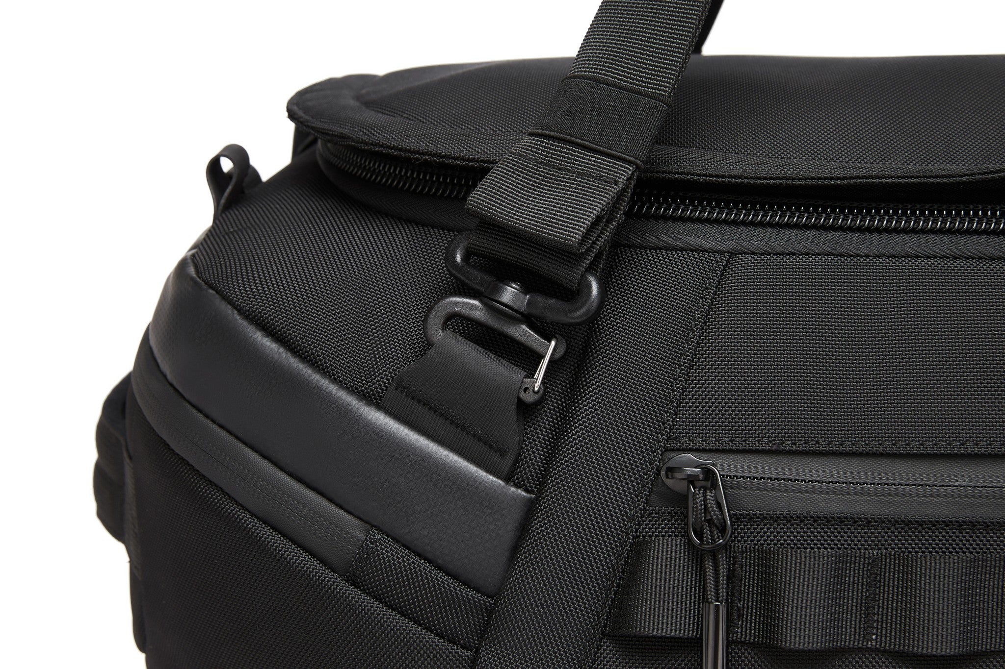 Close-up of the top carry handle, zipper pulls, and metal carabiner clip