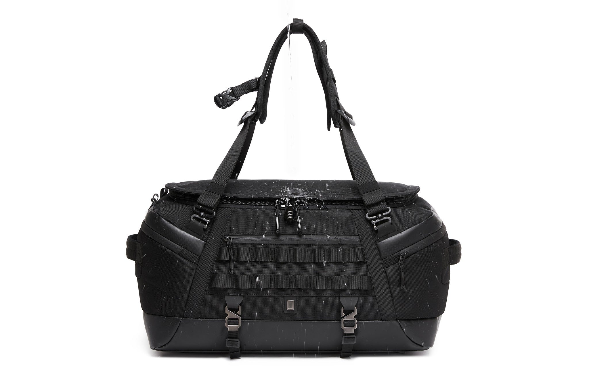 Black Cargo Duffel 45L, front view, with water poured over the top to demonstrate the water-resistant coated exterior; combination lock and MOLLE webbing visible on the front panel