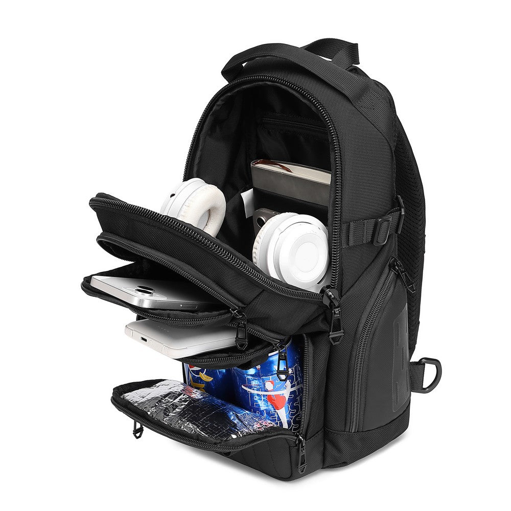 Ridge Sling 8L in Black, three-quarter angle with compartments open showing headphones, phone, laptop, and a drink can