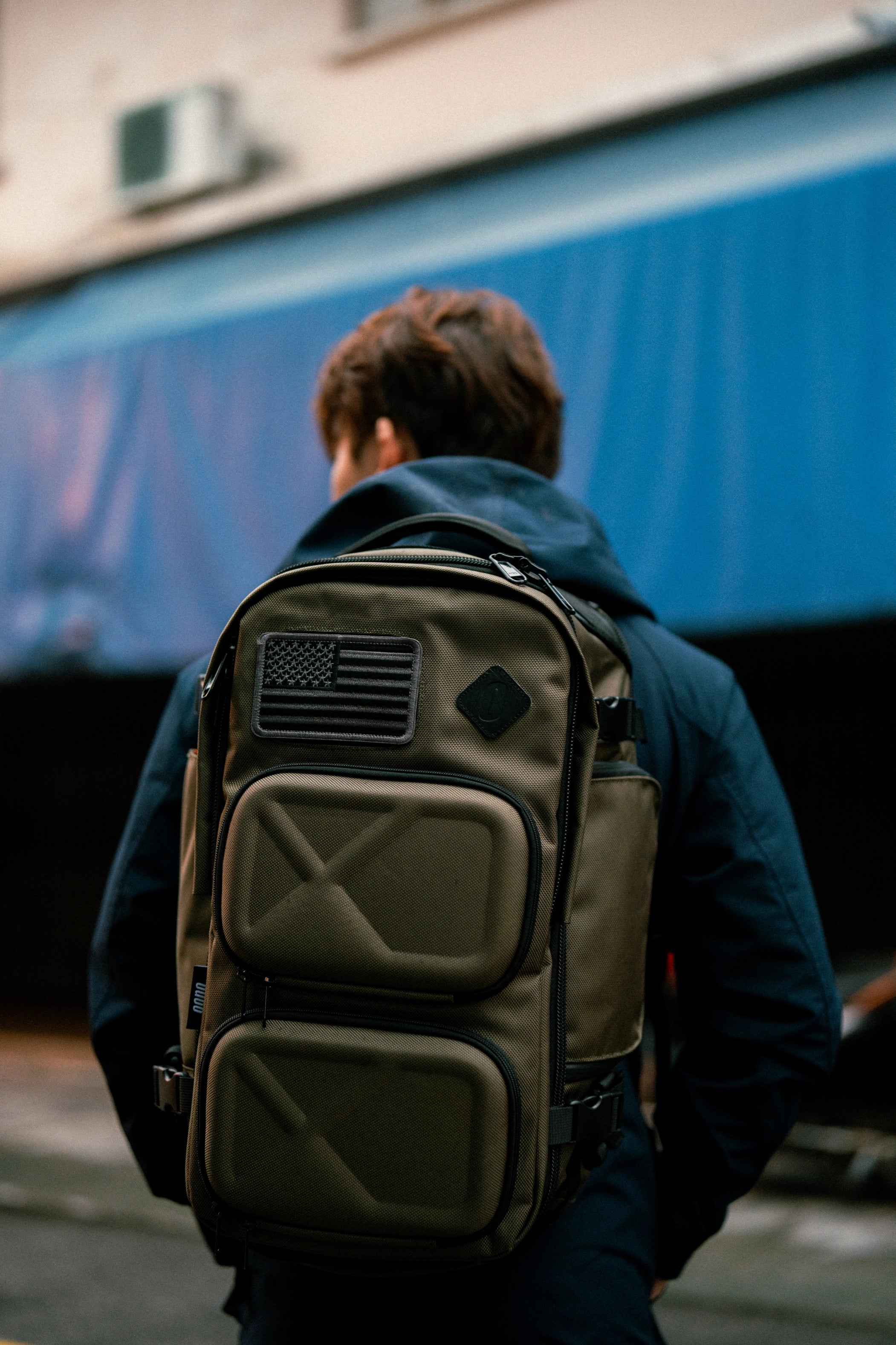 Oono Backpack V3.5 20L in Olive Green, lifestyle shot worn on the back